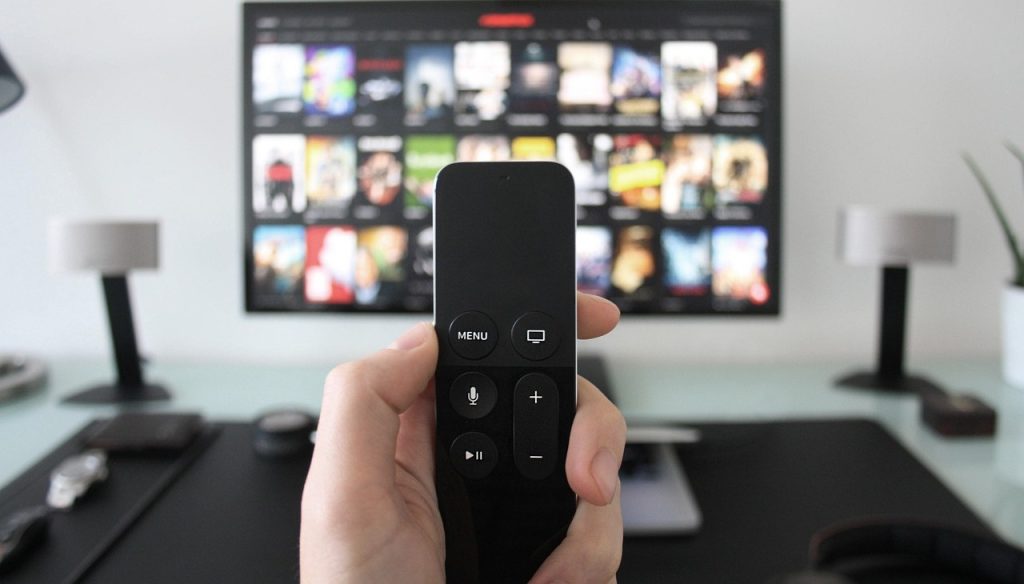 a person holds a remote for streaming tv (1)