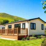 Static Caravans beautifully displayed in a scenic setting with greenery and a blue sky.