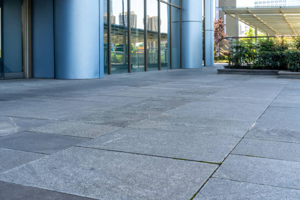 empty concrete floor in front of modern buildings in the downtown street.