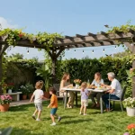 3D pergola configurator showcasing a stylish outdoor space for family gatherings with vibrant plants and a dining setup.