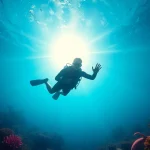 Tauchschule unter Wasser mit einem Tauchinstruktor und bunten Korallen.